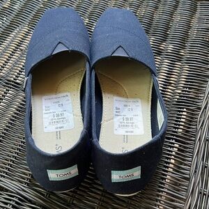 Tom’s navy loafers
